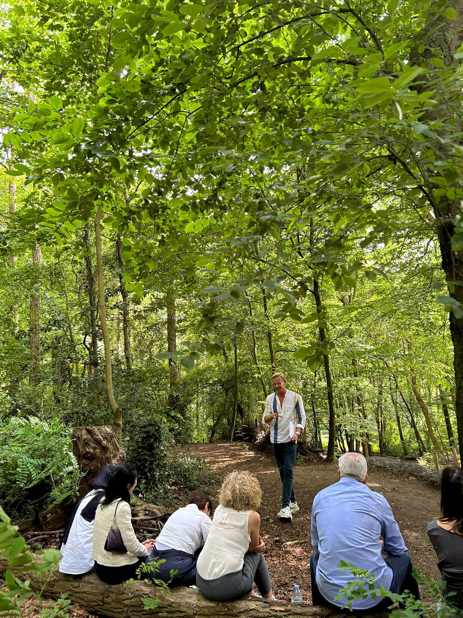 Gareth Couch working with coaches outdoors in a forest
